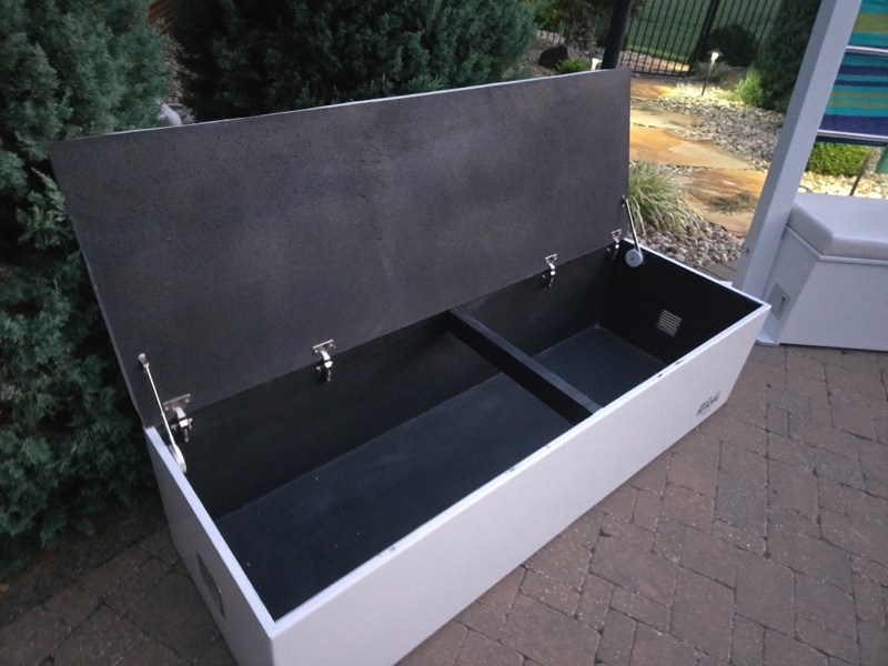 The Pier — low storage bench with the lid open and a black ventilated interior